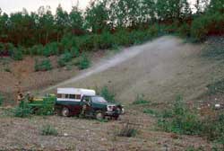 A small tow-behind hydroseeder in use 